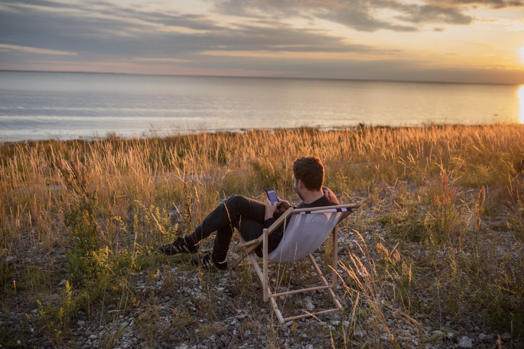 Man at the seaside using mobile phone_Renee Altrov.jpg